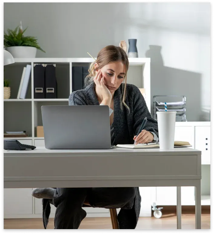 medium-shot-woman-working-desk.webp